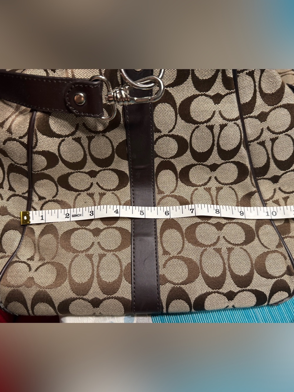 Coach duffle bag khaki/brown w/strap slight wear/tear. - Picture 12 of 14